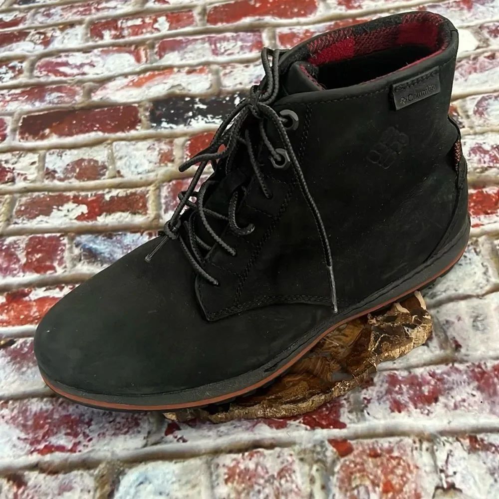 Columbia black boots with red plaid trim